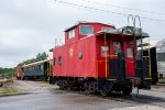 Cabooses and other passenger equipment outside the Springdale Depot 